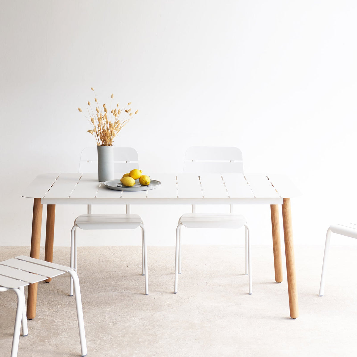 Alicante outdoor dining table with alicante dining chairs in white - Originals Furniture Singapore