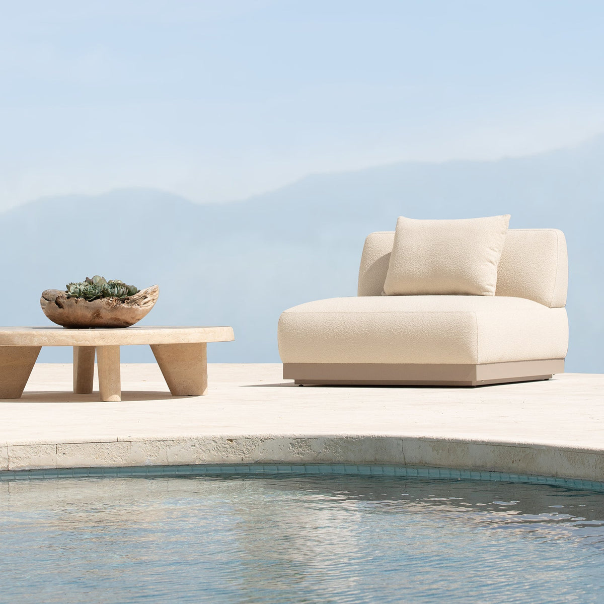 Amalfi Outdoor Armchair, support and comfort from the structured seat, finest Italian fabric on the aluminium plinth base. Available at $5000.